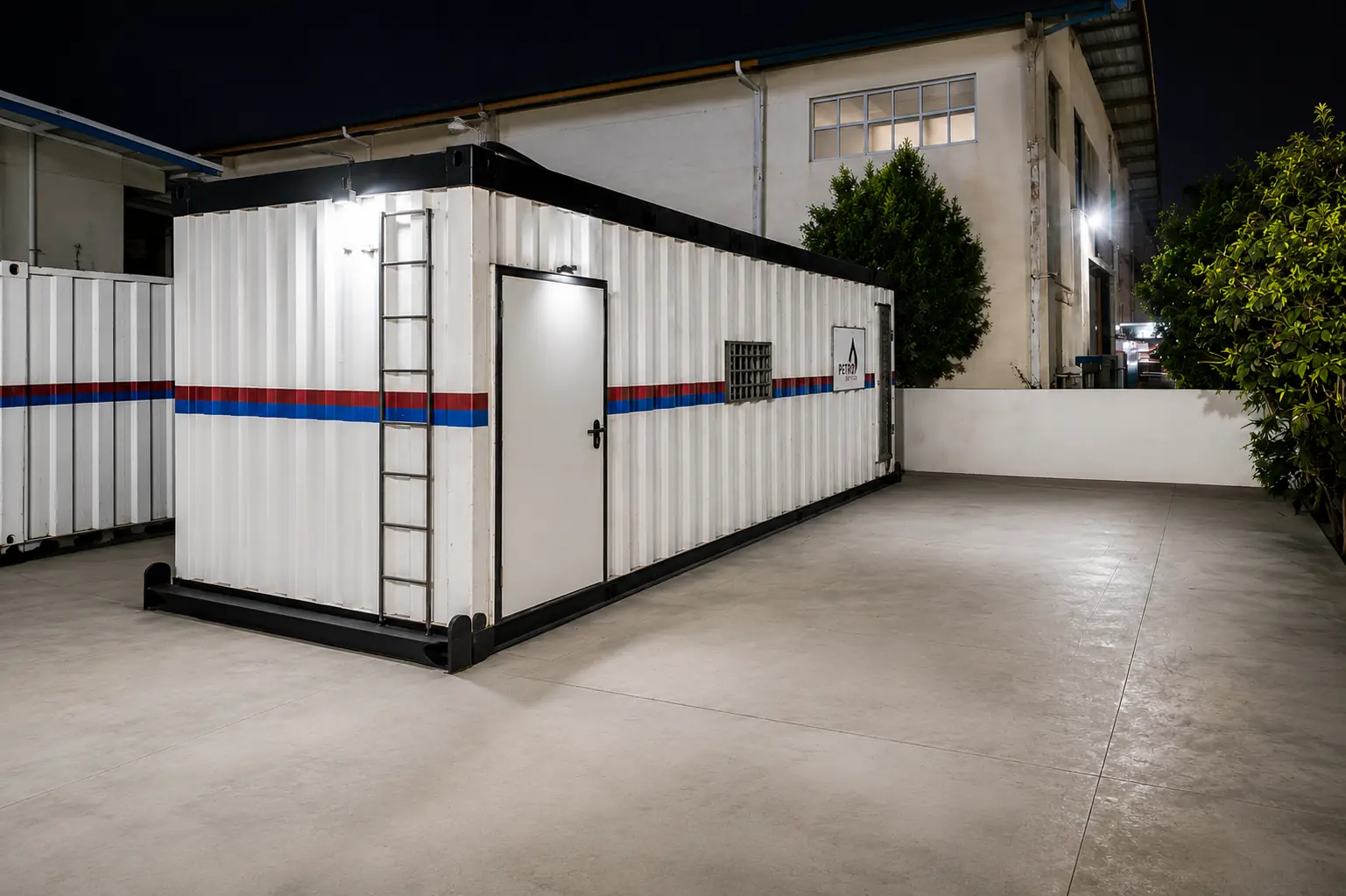 Petroservices pressurized mud logging unit at the operational facility at night